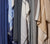 Various colors of throws in the closet