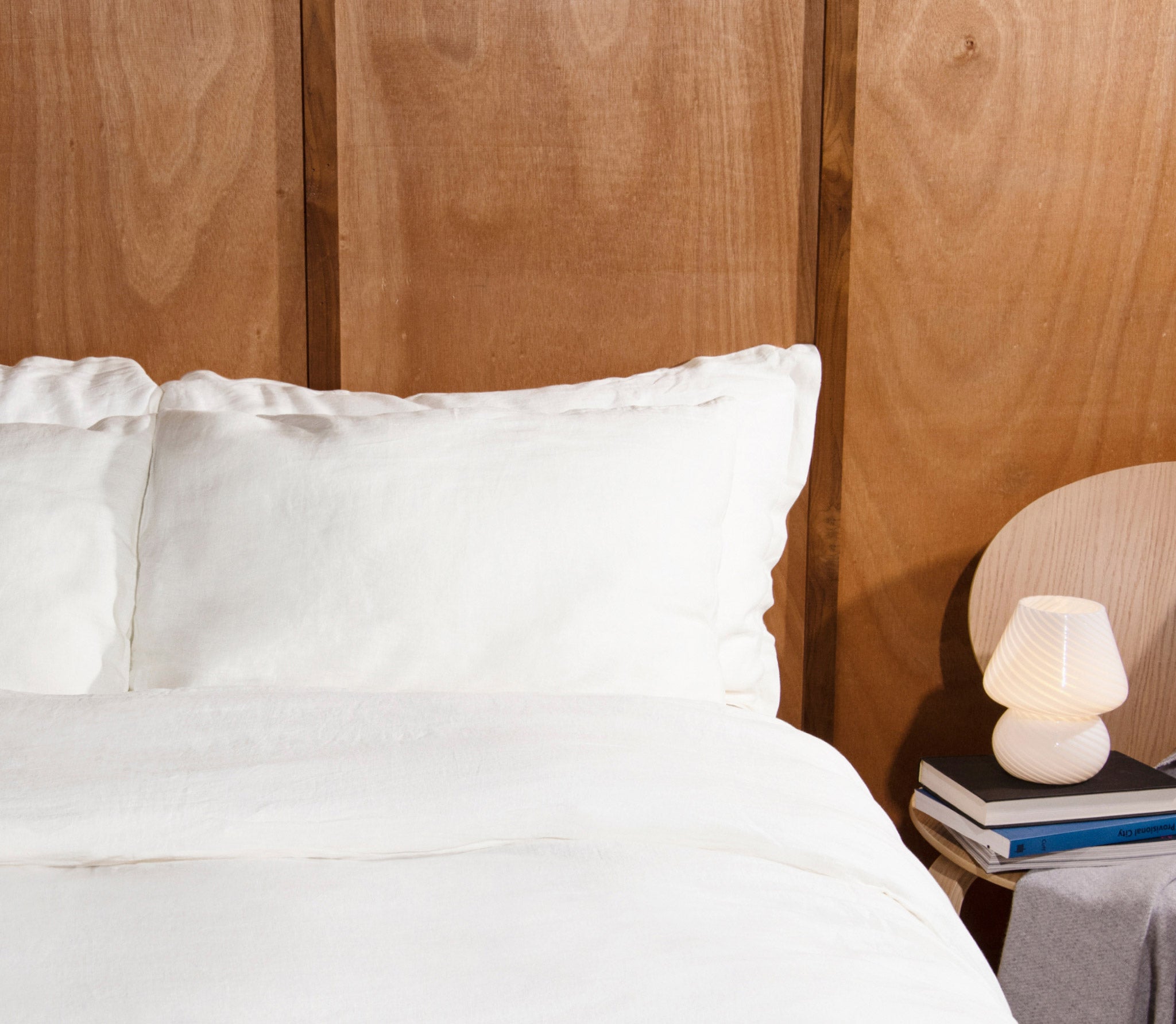 white pillow cases in bed