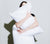 Woman partially shown, hugging two Down Pillows inside Percale Pillow Cases.