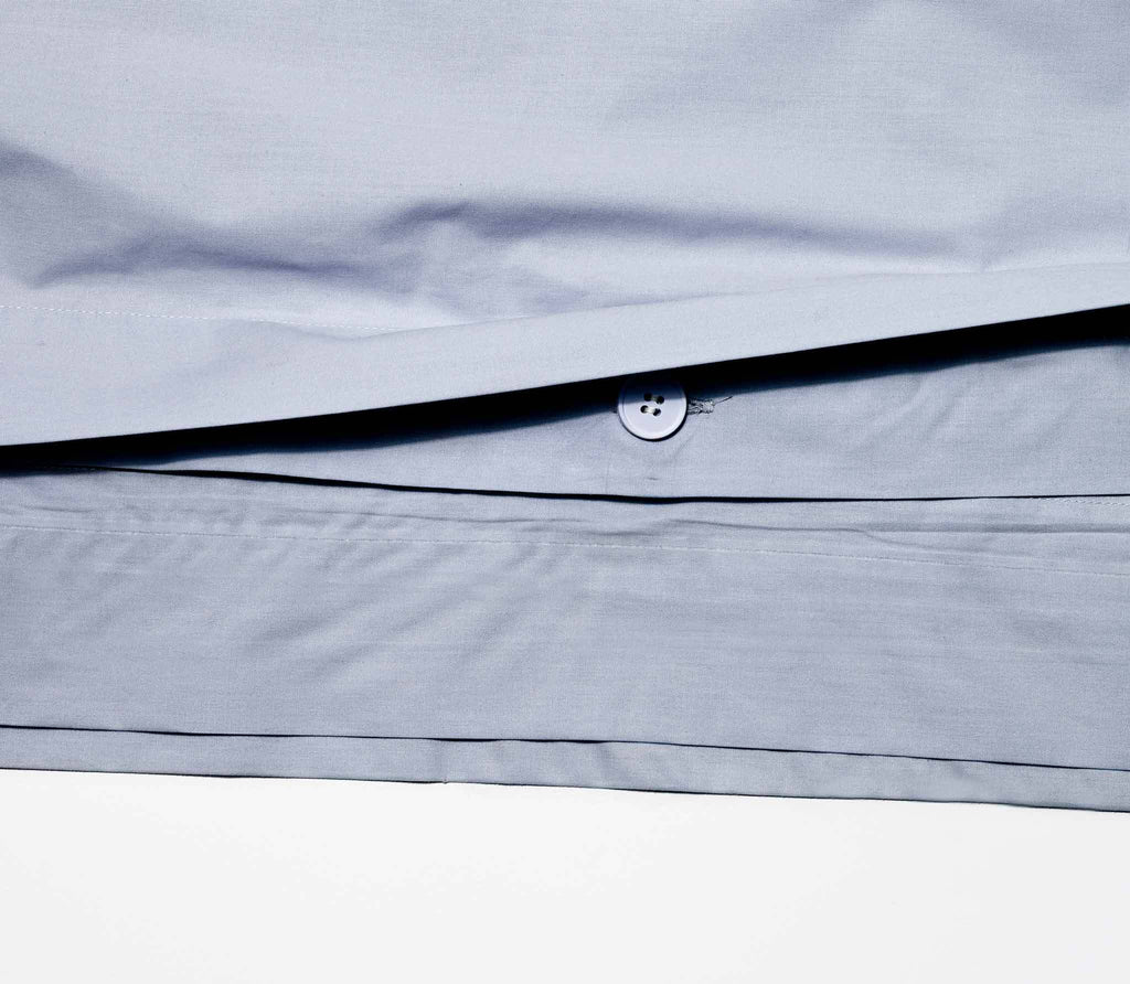 a detail of duvet sheet with a one round button