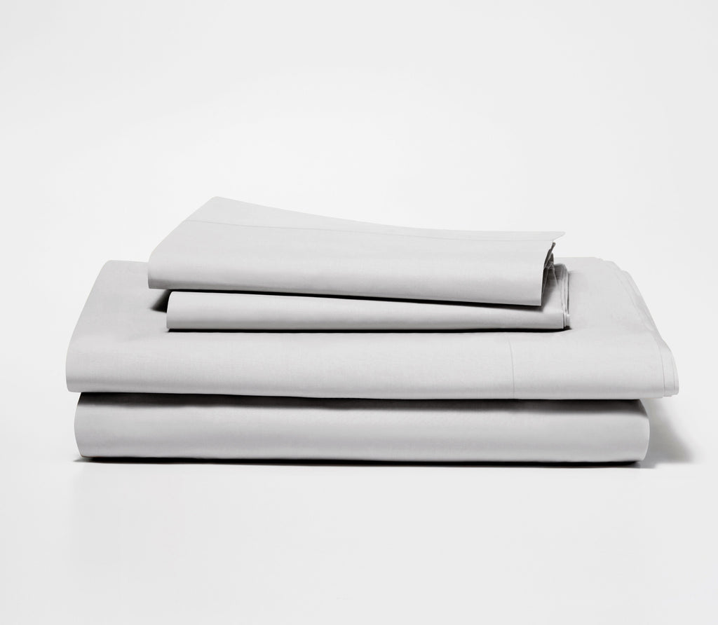 a bundle of neatly folded sheets