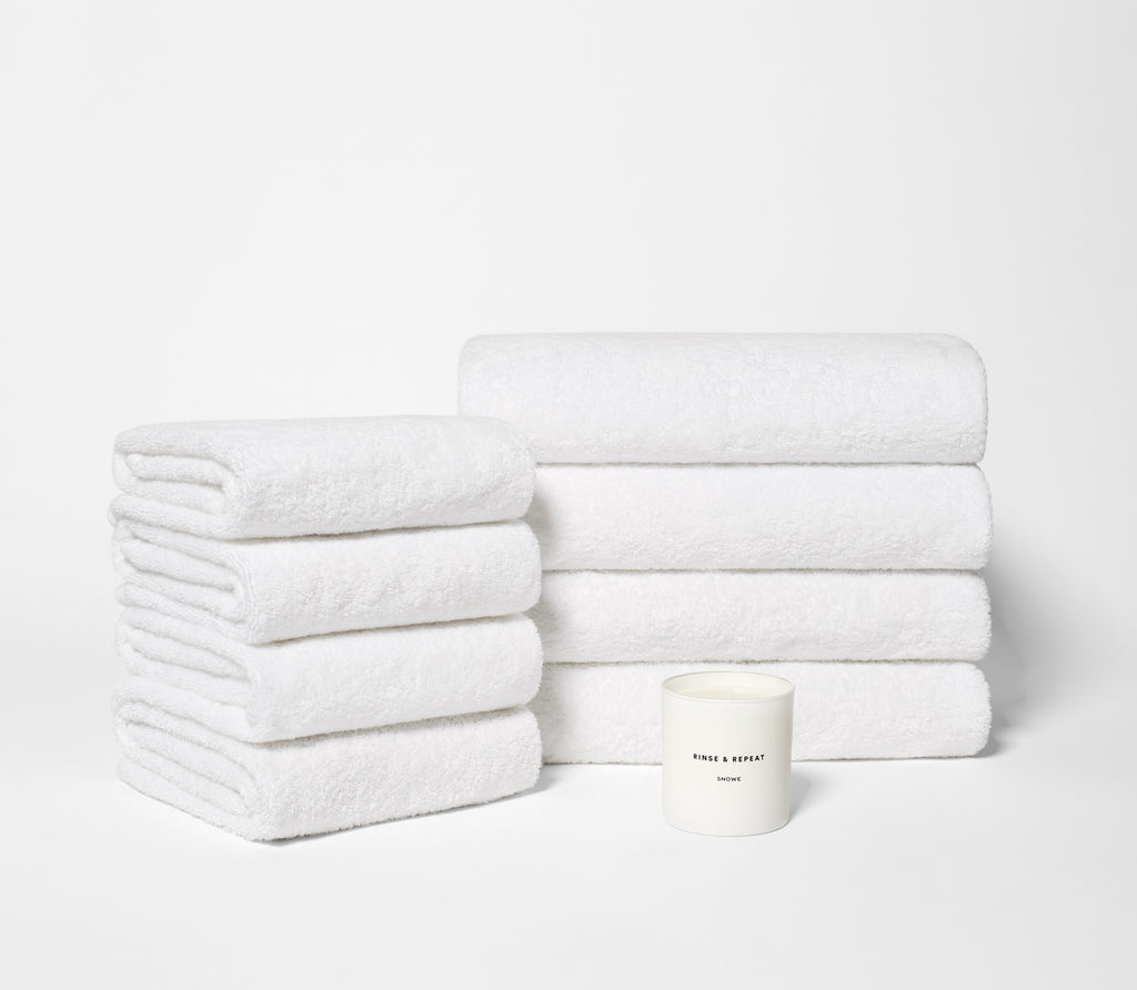 white folded bath towels