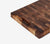 Close up showing texture of our End-Grain hand crafted, black walnut, rectangular cutting board with a white background.
