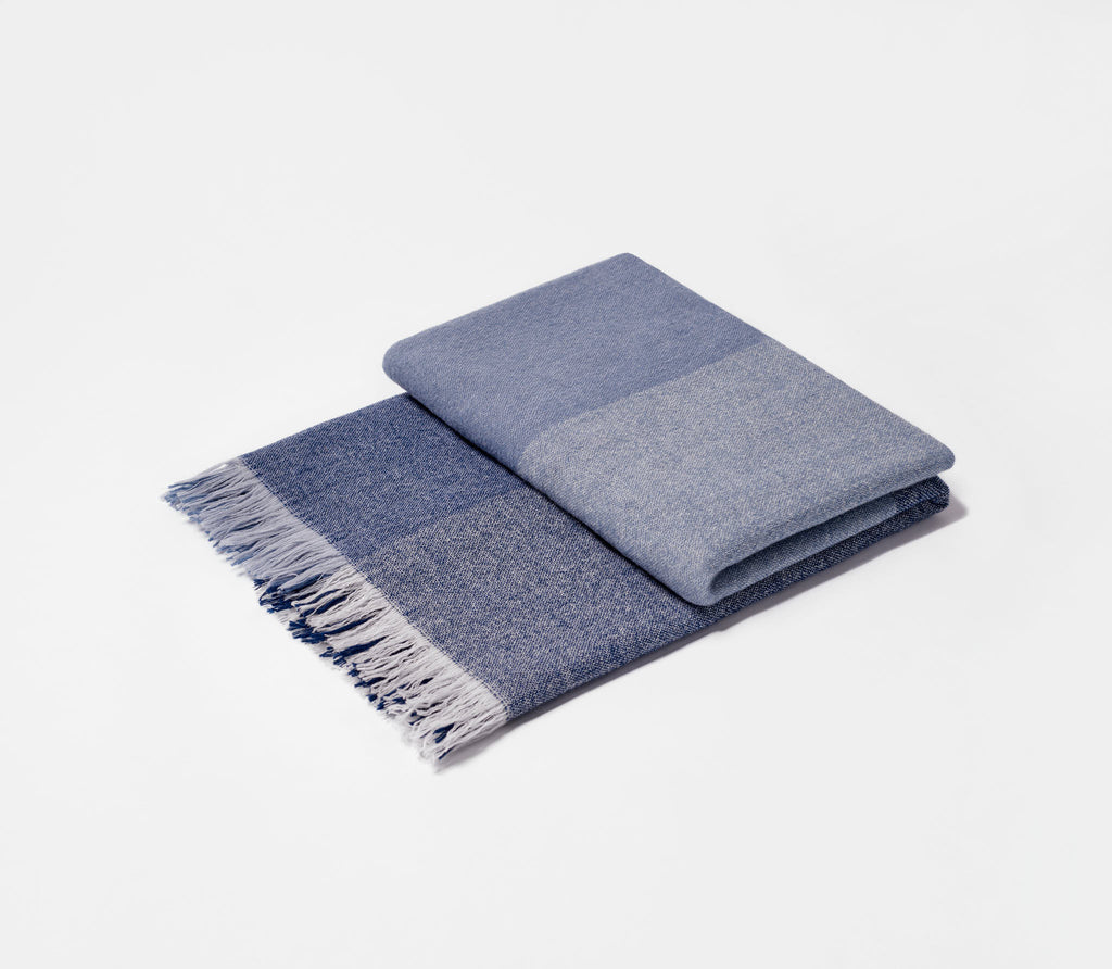 Folded Slate Blue Checked Throw showing fringed edge.