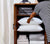 woman organizing her linen closet