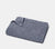 Folded Slate Blue Honeycomb Bath Towel with white background.