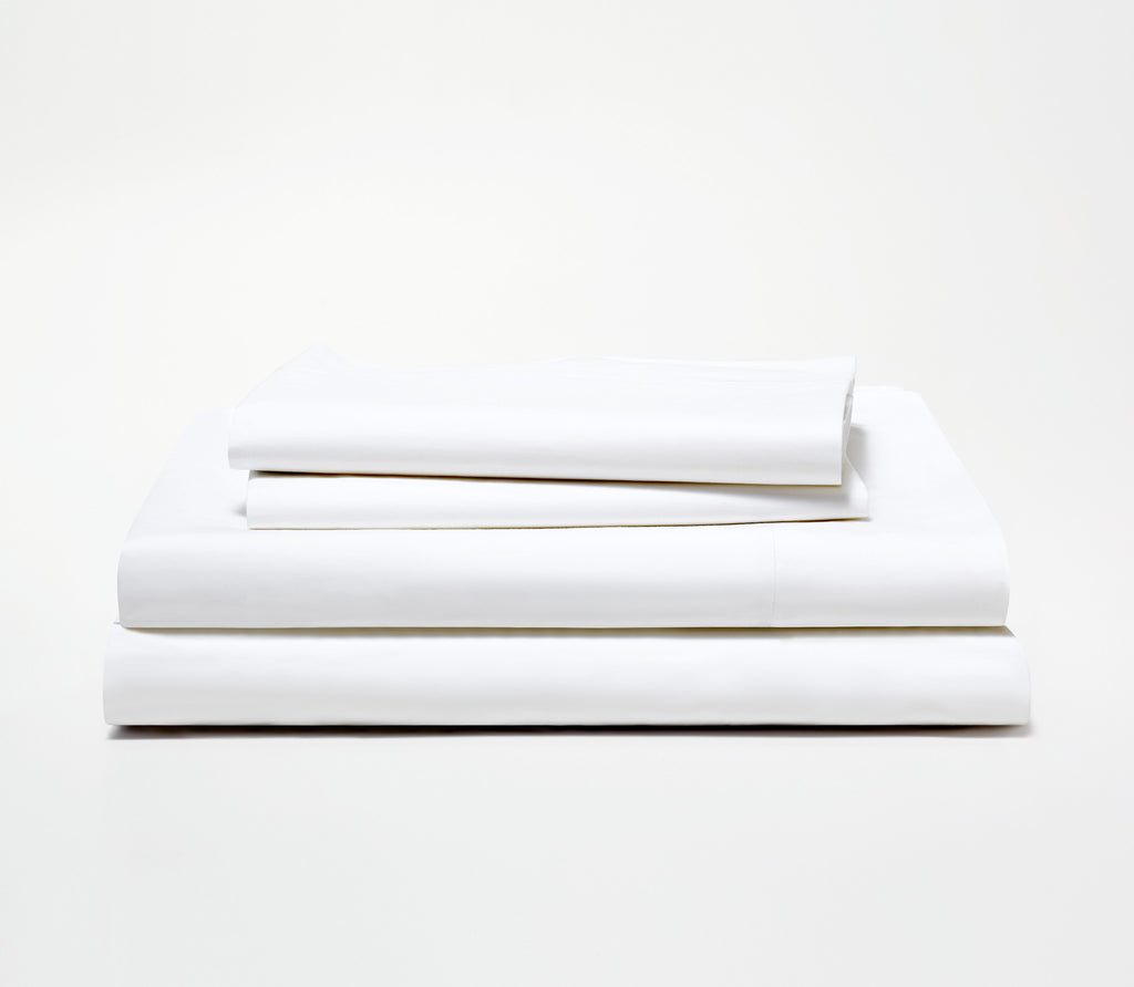 folded white sheet sets