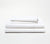 Folded set of two Essential White Percale Pillow Cases on top of a folded Percale Fitted Sheet and Flat Sheet.