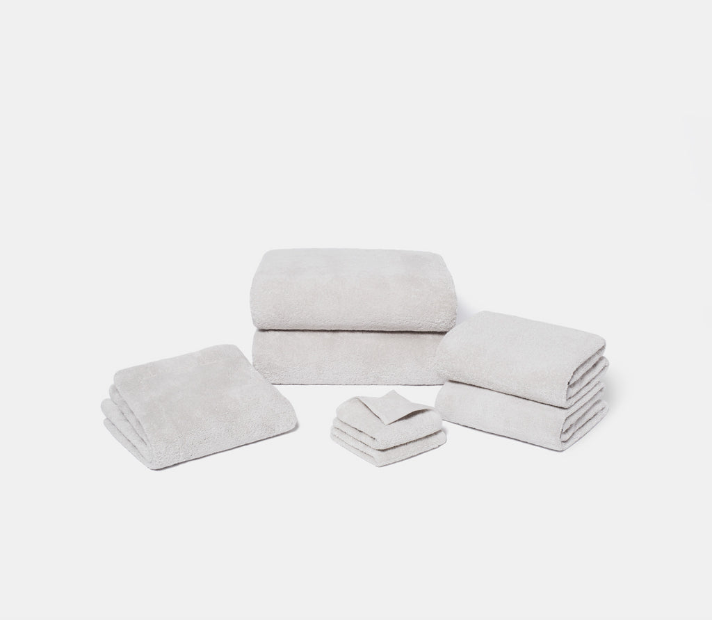 a set of folded ash grey towels