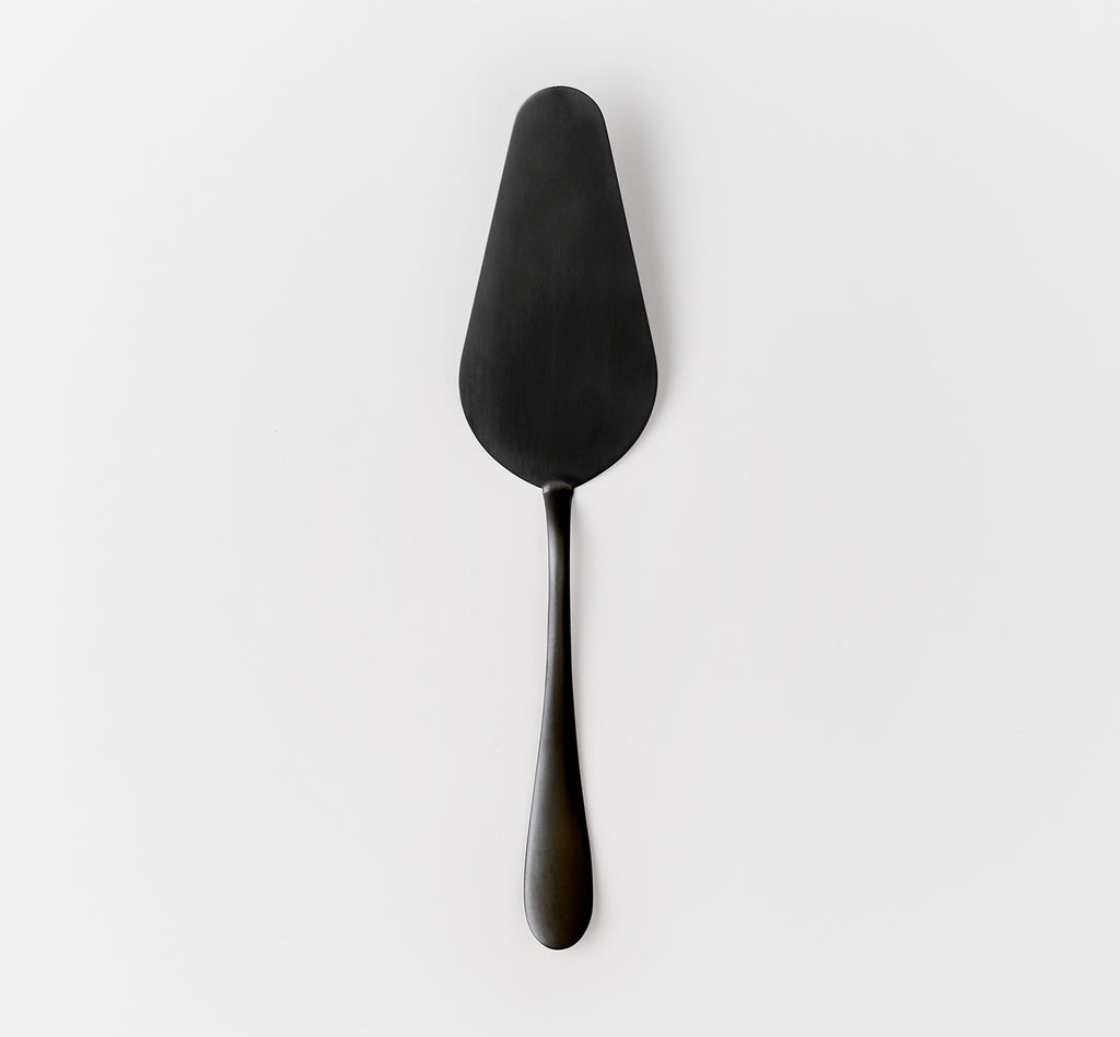 one black stainless steel cake server