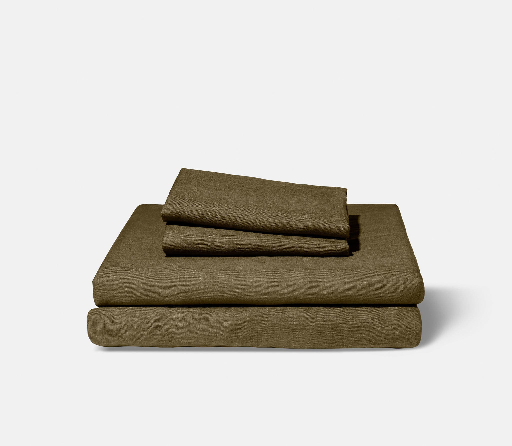 neatly folded olive-colored sheets