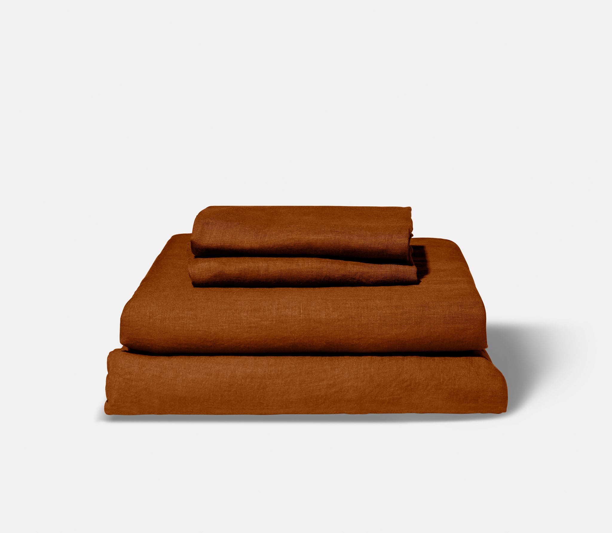 folded teracotta linen sheets