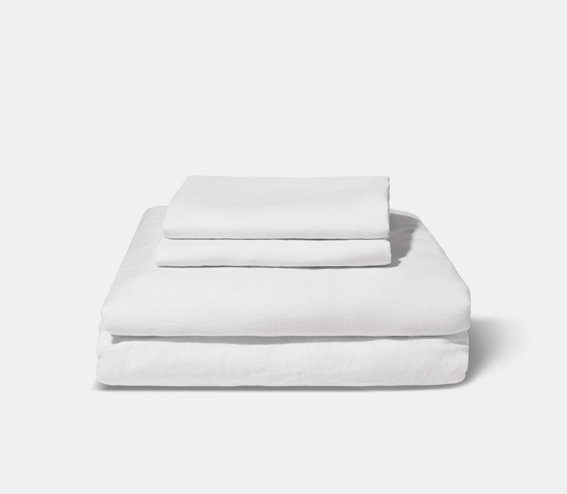 folded white linen sheets